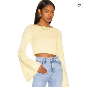 Revolve cropped sweater in pastel yellow. The Brand is lover and friends.